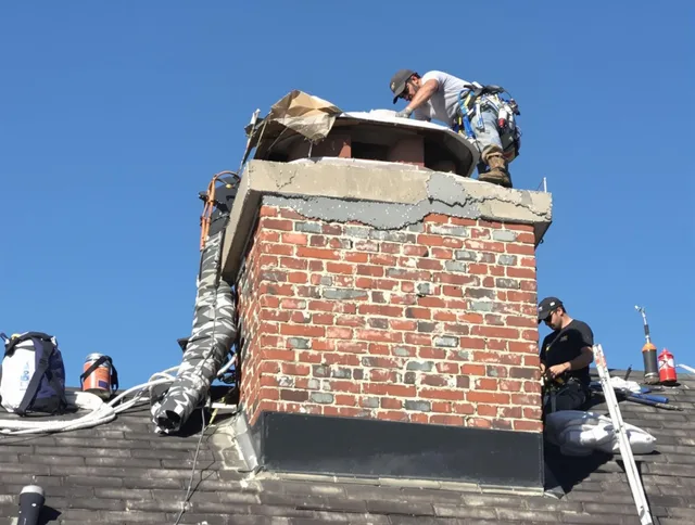 Placentia Chimney Sweep installing a custom chimney crown in Placentia, CA