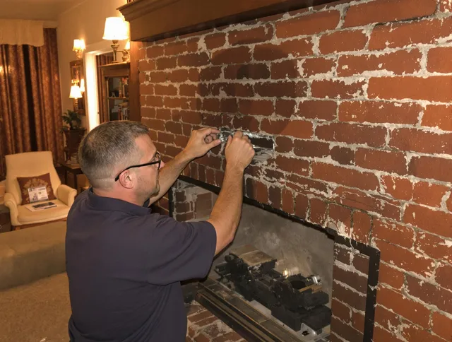 Placentia Chimney Sweep expert fixing a fireplace in Placentia, CA